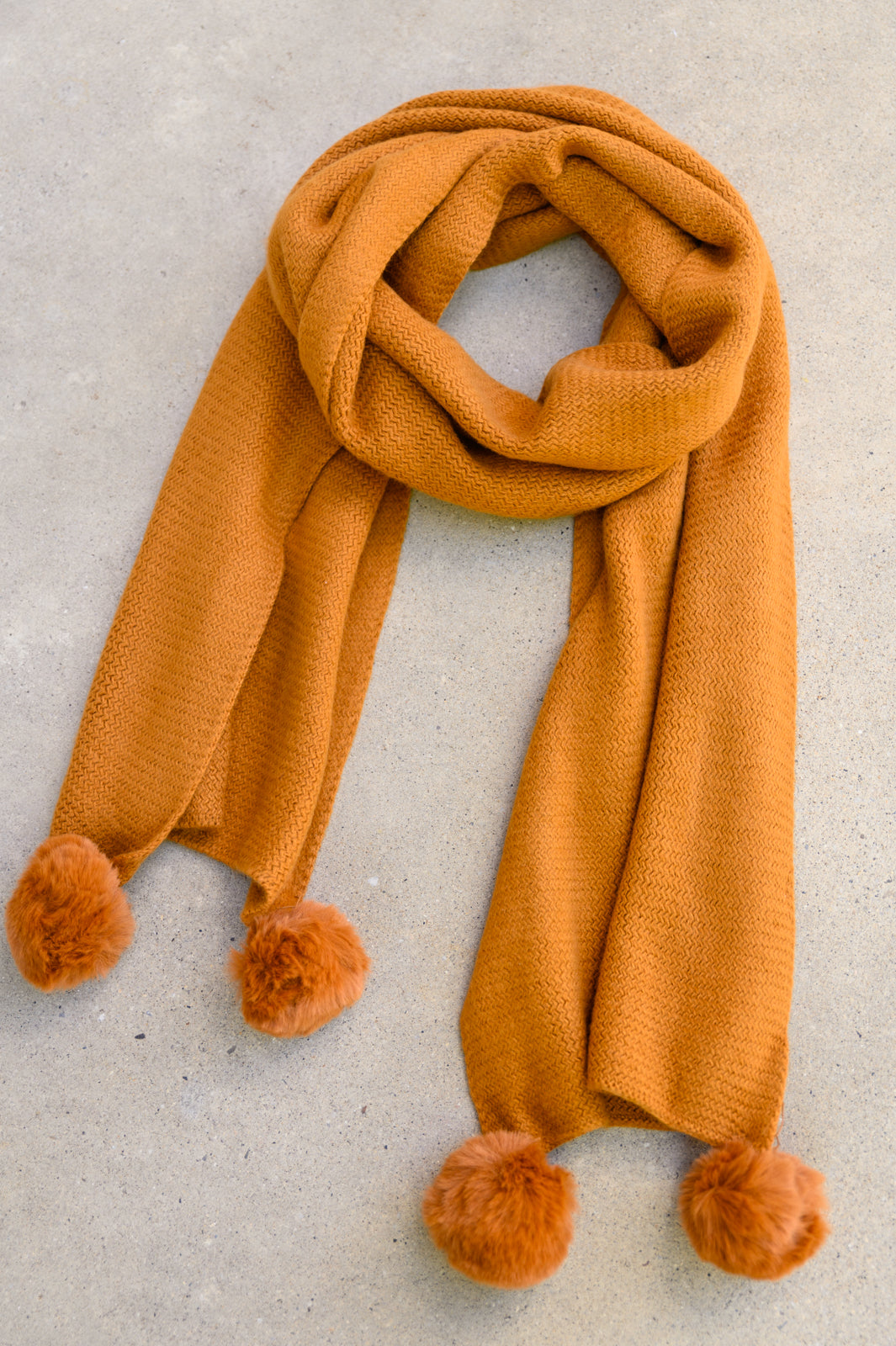 Knitted Fuzzy Pom Pom Scarf In Ginger